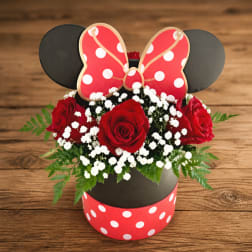 Red roses in a Minnie Mouse-themed box with white baby's breath