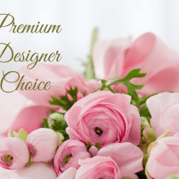Pink ranunculus bouquet with green accents and the words Premium Designer Choice