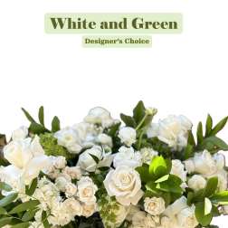 White and green floral arrangement with roses and hydrangea