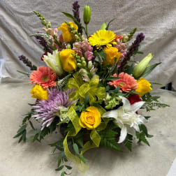 Colorful mixed flower basket with roses, lilies, and gerbera daisies