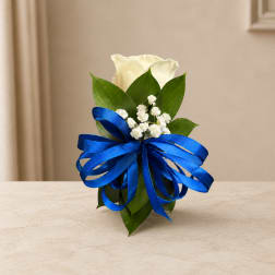 White calla lily arrangement with a blue ribbon bow
