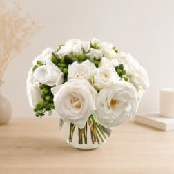 White rose bouquet in a clear glass vase