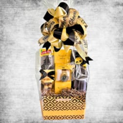 Gift basket with chocolates, a watch, and black-and-gold ribbon