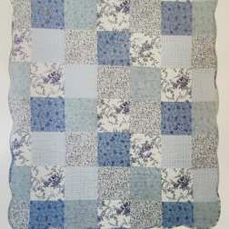 Blue and white patchwork quilt with floral prints
