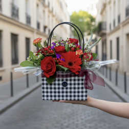 Red rose and gerbera bouquet in a checkered gift box