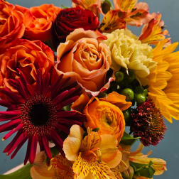 Colorful bouquet with roses, gerbera daisies, carnations, and alstroemeria