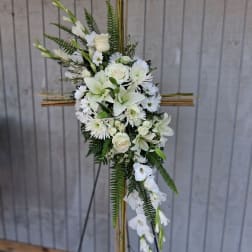 White floral standing spray on a bamboo easel