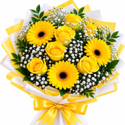 Yellow roses and gerbera daisies with white filler flowers in wrapped bouquet
