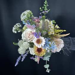 Mixed pastel bouquet with daisies, roses, and airy filler flowers