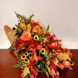 Autumn bouquet with orange roses and yellow daisy-like flowers
