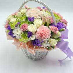 Mixed pastel flower basket with roses, carnations, and daisies