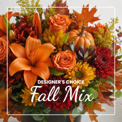 Fall bouquet with orange lilies, roses, and chrysanthemums in a vase