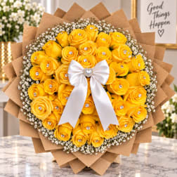 Bouquet of yellow roses with a white bow and brown paper wrap