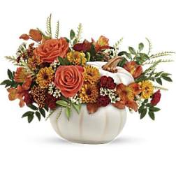 Autumn floral arrangement in a white pumpkin-shaped vase
