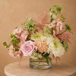 Pink and white mixed bouquet in a clear glass vase