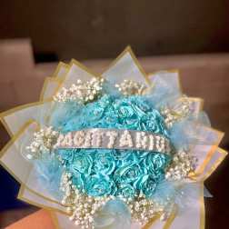 Turquoise rose bouquet with baby's breath and gold-edged wrapping