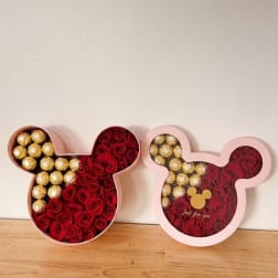 Mickey-shaped gift boxes filled with red roses and gold chocolates