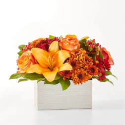 Orange lilies and roses in a white rectangular box