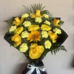 Yellow rose and carnation bouquet with a sunflower, wrapped in black paper