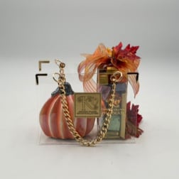 Gift bag with a pumpkin decoration and boxed chocolates