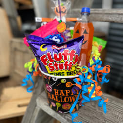 Halloween candy bucket with a Fluffy Stuff bag and a pumpkin drink bottle