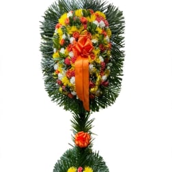 Large floral standing wreath with orange ribbon on a white background