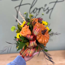 Orange rose bouquet with a small pumpkin and plaid ribbon