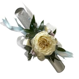 Cream rose boutonniere with ribbon and greenery