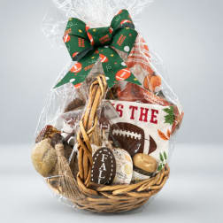 Basket gift set wrapped in clear cellophane with a football-themed bow