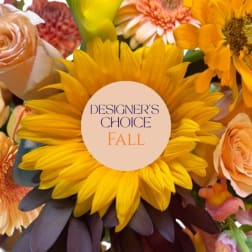 Fall bouquet with a large yellow sunflower and peach roses