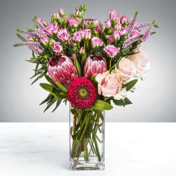 Mixed pink bouquet in a clear glass vase