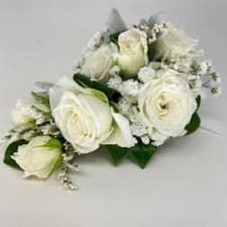 White rose bouquet with baby's breath and greenery