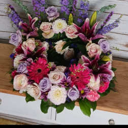 Mixed bouquet with pink lilies, roses, and purple flowers