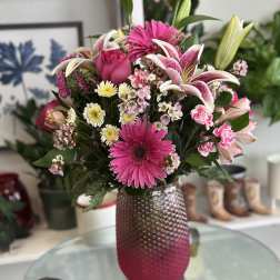 Pink and white mixed bouquet in a textured vase