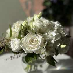 White rose bouquet in a clear glass vase