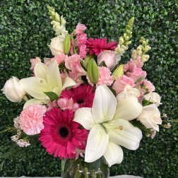 Pink and white mixed bouquet in a clear glass vase