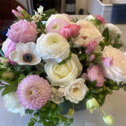 Bouquet of pink and white flowers with roses and dahlias
