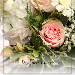Pink roses and white flowers in a mixed bouquet