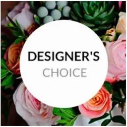 Designer’s choice floral arrangement with pink and peach roses