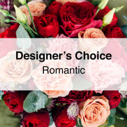 Bouquet of red and peach roses with pale pink flowers