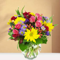 Colorful mixed bouquet in a clear glass vase