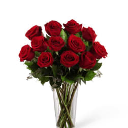 Bouquet of red roses in a clear glass vase