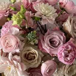 Bouquet of pink and cream flowers with roses and dahlias
