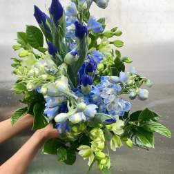Blue and green mixed bouquet with tall buds and clustered blooms