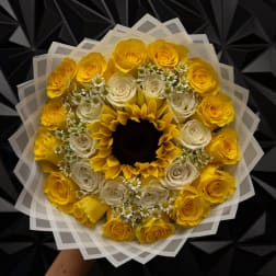 Yellow and white rose bouquet with a sunflower center