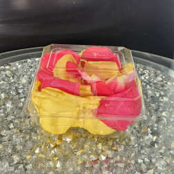 Clear plastic box of pink and yellow rose petals