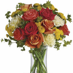 Mixed roses and carnations in a clear glass vase
