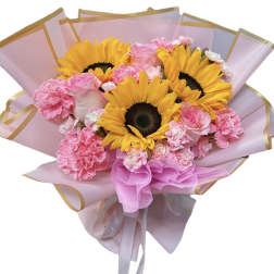 Bouquet of sunflowers and pink carnations wrapped in pink paper
