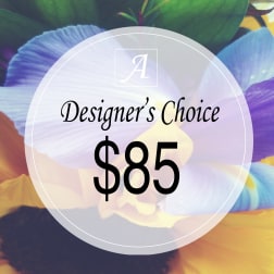 Designer’s choice $85 floral arrangement graphic over colorful petals
