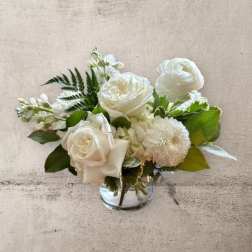 White floral bouquet in a clear glass vase